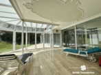 Wintergarten - BERK Immobilien – Ein Ort zum Ankommen – Großzügiges Refugium mit Weitblick und Privatsphäre