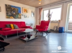 Wohnzimmer - BERK Immobilien – Attraktive 2-Zimmer-Wohnung mit Balkon in Karlstein-Großwelzheim