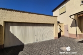 Garage - BERK Immobilien – Charmantes Einfamilienhaus mit Potenzial im Herzen von Stockstadt